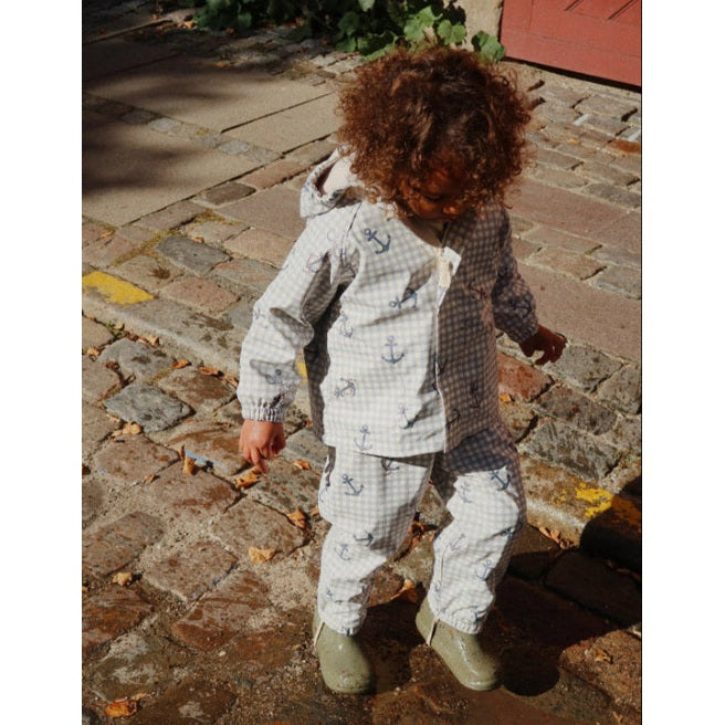 Konges Sløjd Rainy Palme Set Sailor Check toddler outfit in light blue anchor print on cobblestone street