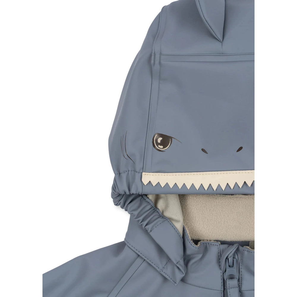 Konges Slojd Sharka Rain Set Tradewinds in Tradewinds blue with shark-face hood and beige fleece lining
