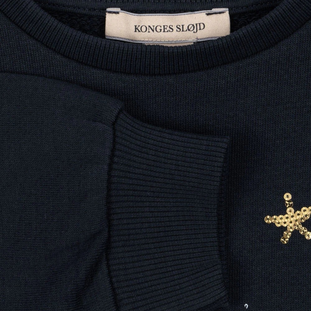 Konges Slojd Sweatshirt Dark Navy with ribbed cuffs and gold sequin star embellishments.