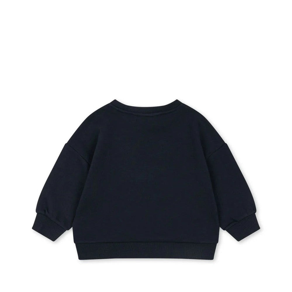 Konges Slojd Sweat Shirt Dark Navy laid flat to show roomy pullover with ribbed cuffs and hem.