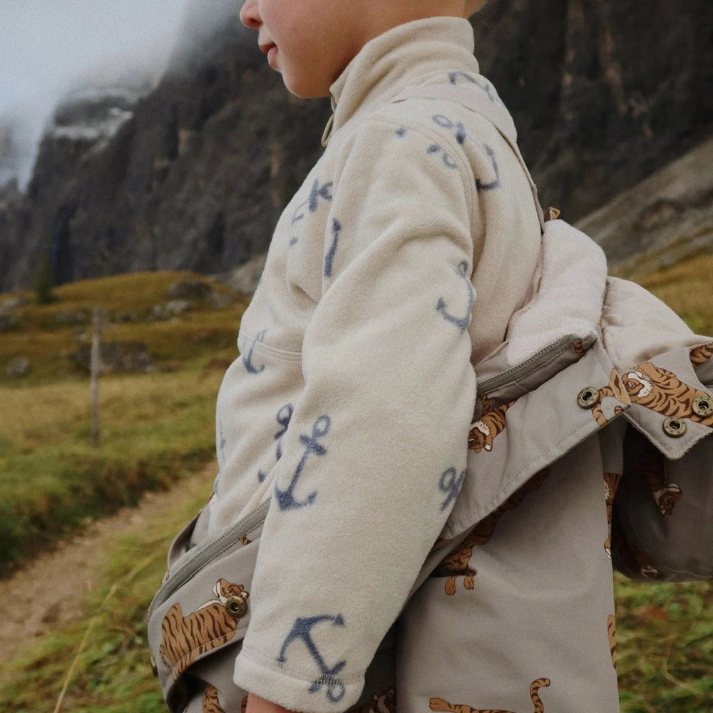 Konges Slojd Tavi fleece sweatshirt for kids, cream with blue anchor prints.