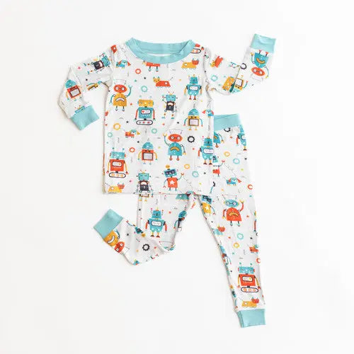 Little Sleepies Bamboo Pajama Set Robots two-piece baby pajamas with turquoise cuffs, laid flat to showcase playful robot print for cozy nights