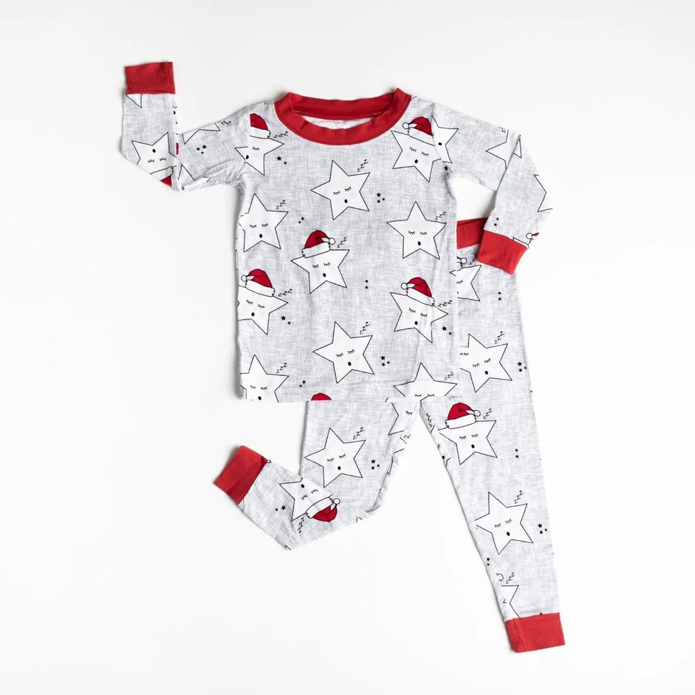 Little Sleepies Bamboo Pajama Set Santa Stars laid flat: gray with white stars, red cuffs, festive Santa hats.