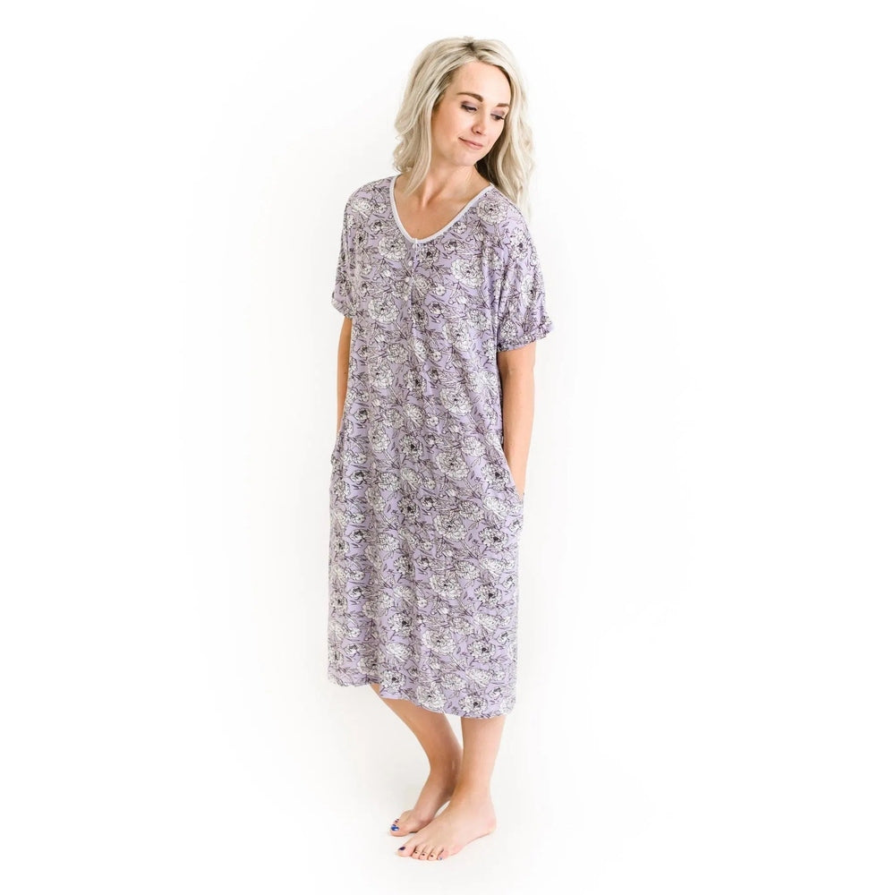 Little Sleepies Bamboo Pajama Set Women's Peonies in lavender, short sleeves, knee-length, model stands with hands in pockets.