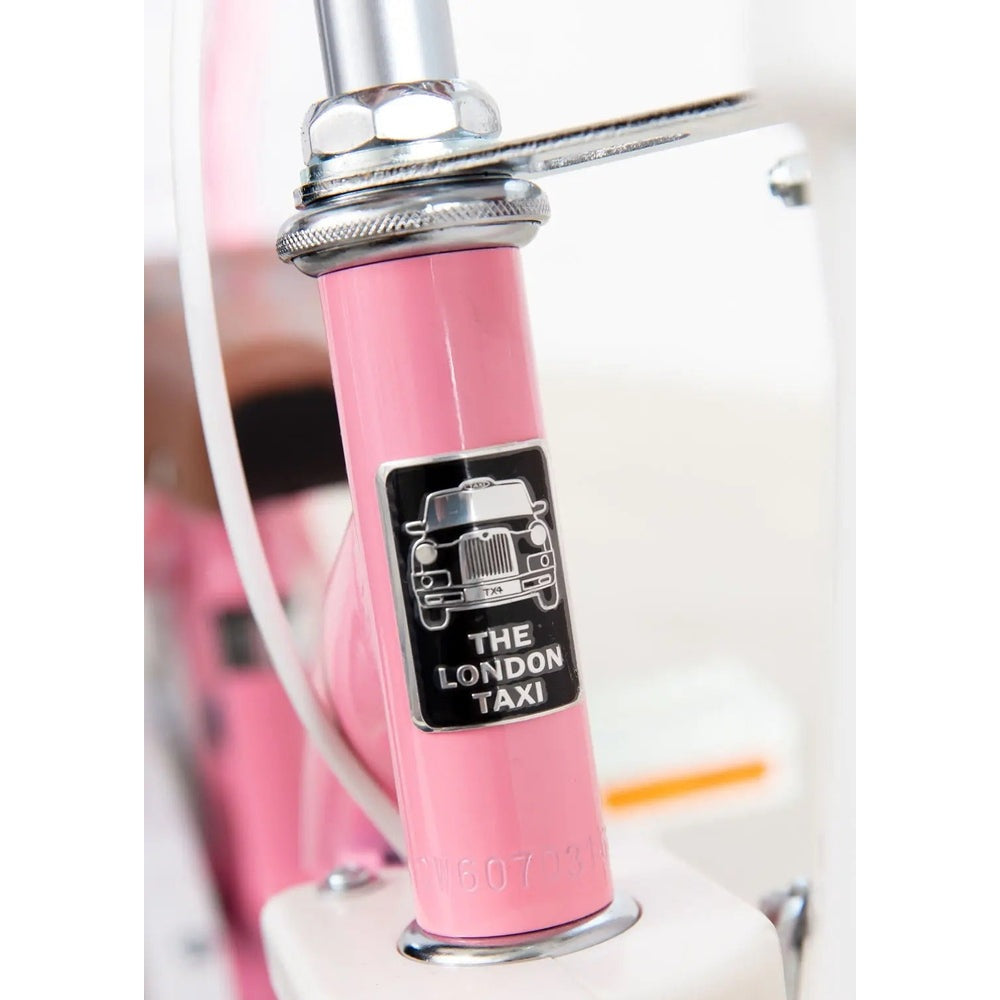 London Taxi 14 Inch Kid's Bike With Pushbar in pink; chrome clamp and badge on the frame are clearly visible.
