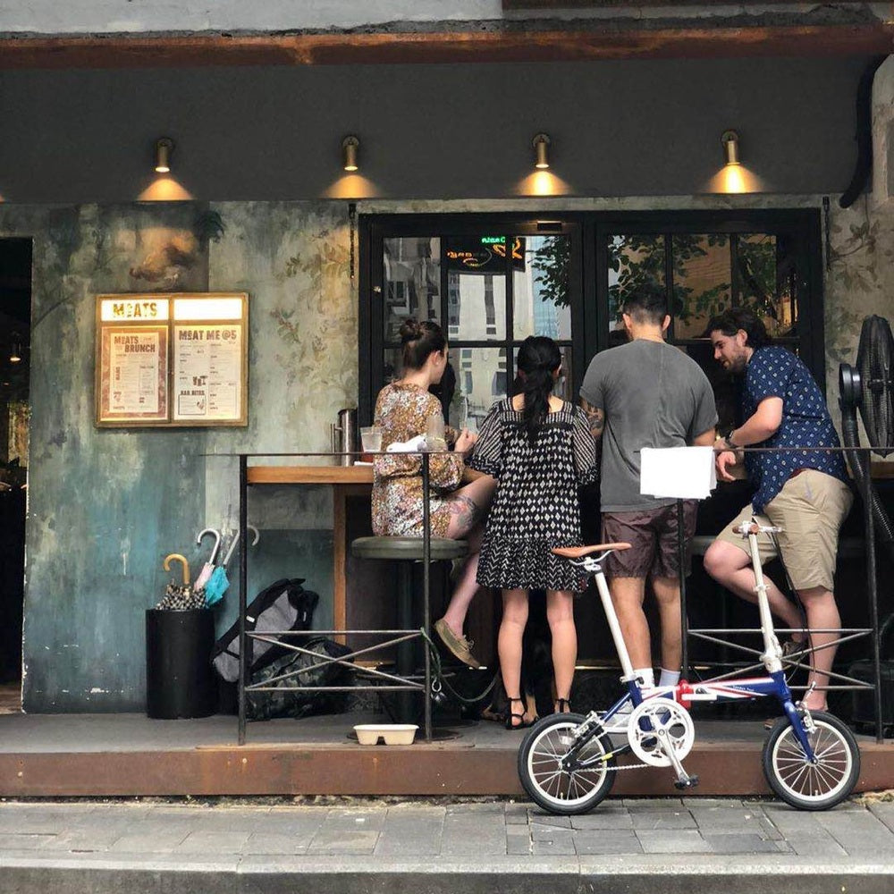London Taxi Folding 14-inch aluminum lightweight bicycle; blue and white frame with red accents, urban folding bike.