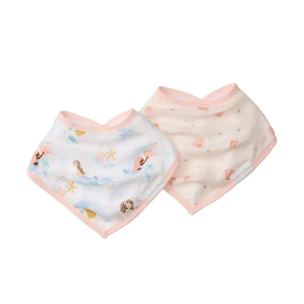 Loulou Lollipop Bandana Bib Set: two pastel bibs in white and pink with sea-themed prints, laid flat.