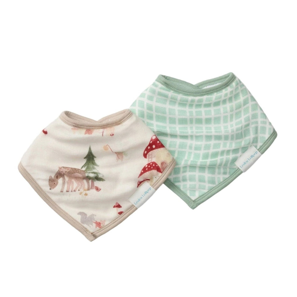 Loulou Lollipop Bandana Bib Set: cream woodland animals bib and mint grid bib laid flat for feeding.