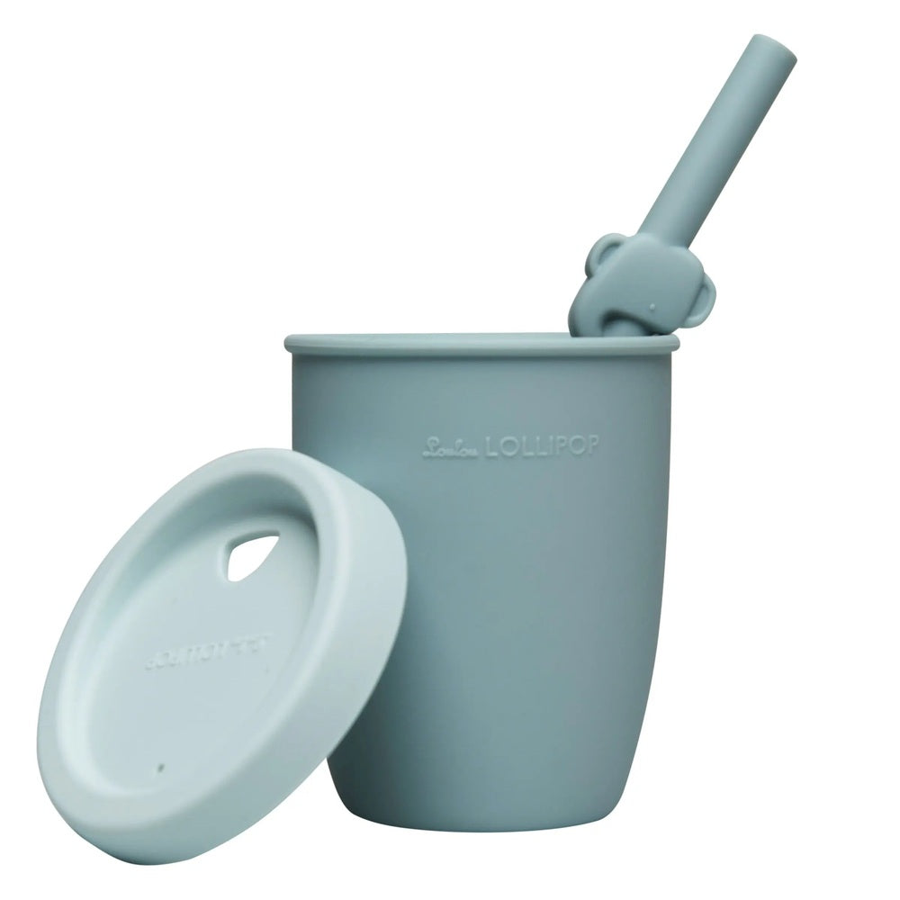 Loulou Lollipop Born To Be Wild Kids Cup With Straw in pastel blue silicone, lid off beside and straw upright.