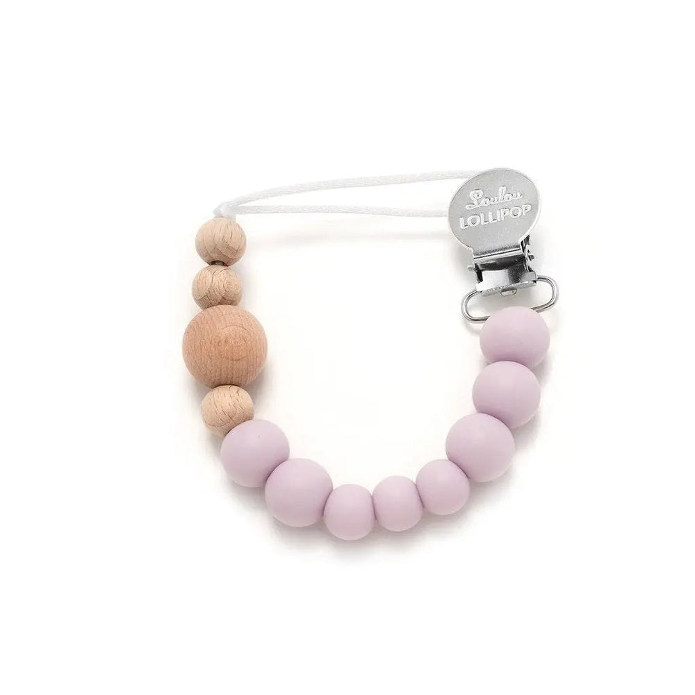 Loulou Lollipop Colour Block Silicone & Wood Pacifier Clip, pastel pink silicone beads with natural wood beads clipped to a shirt