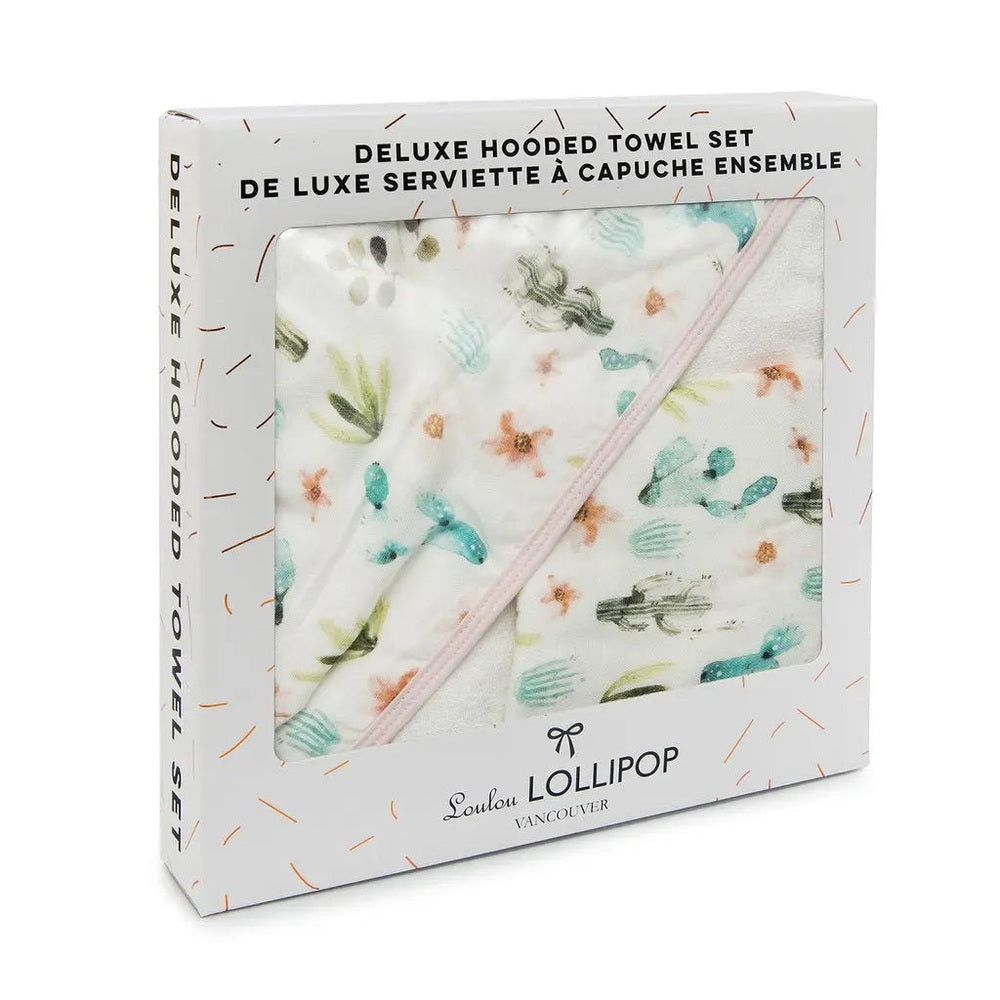 Loulou Lollipop Hooded Towel Set in white with pastel cactus print, shown folded inside its box.