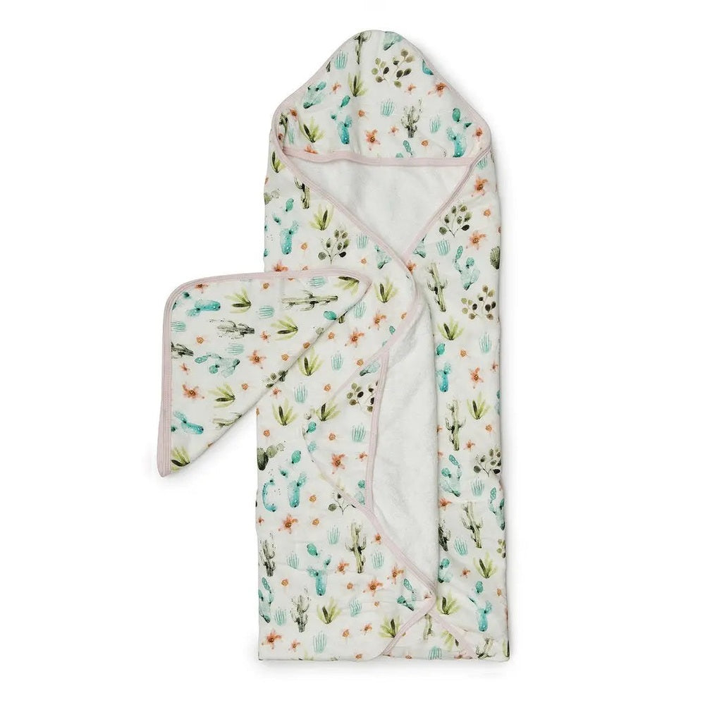 Loulou Lollipop Hooded Towel Set in cactus print with pink trim; two-piece baby bath set shown laid out with hood.