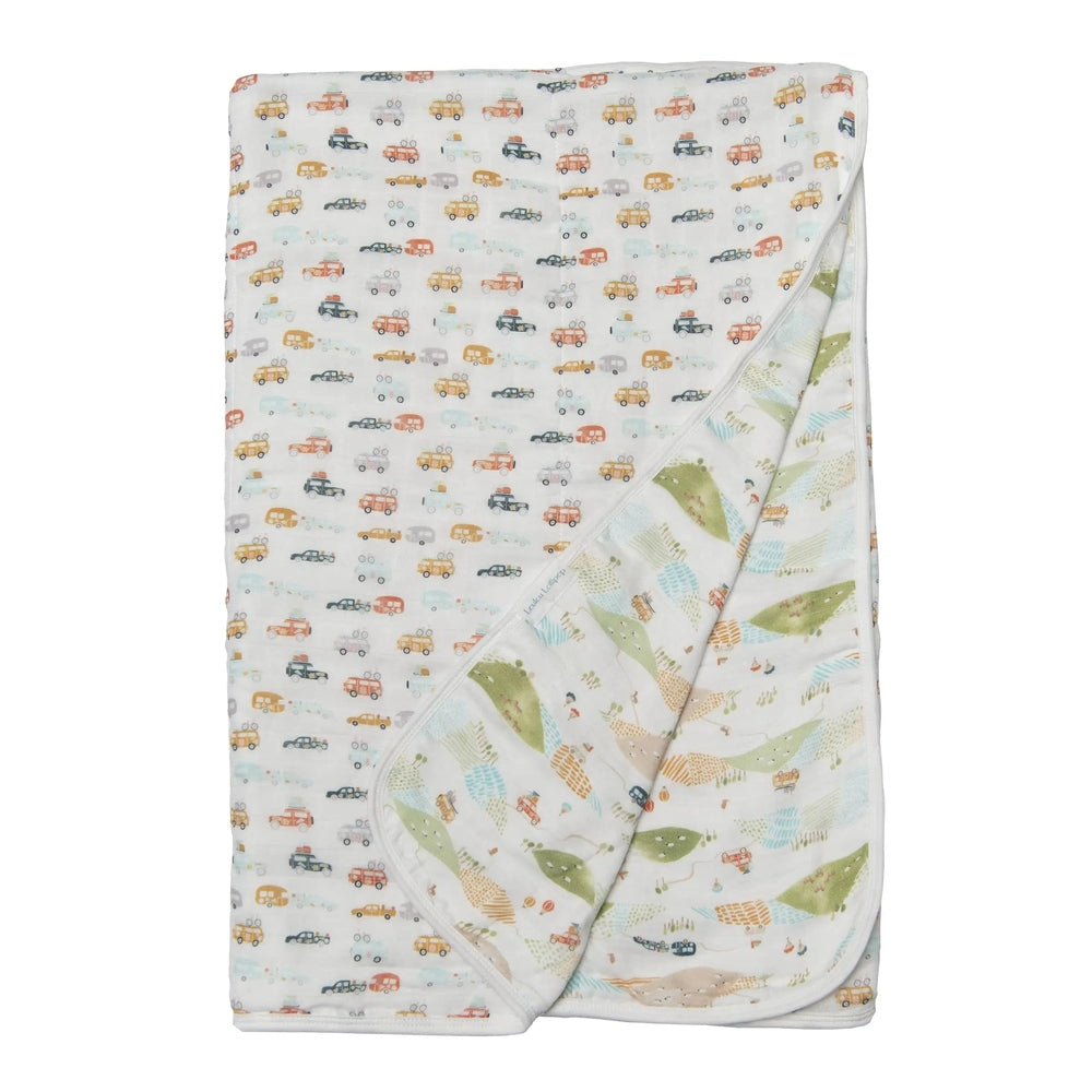 Loulou Lollipop Muslin Quilt Blanket, car-print front and leafy back, shown folded for easy swaddling.
