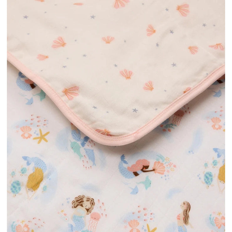 LOULOU LOLLIPOP Muslin Quilt Blanket with pink trim, featuring pastel seashells and mermaids for baby.