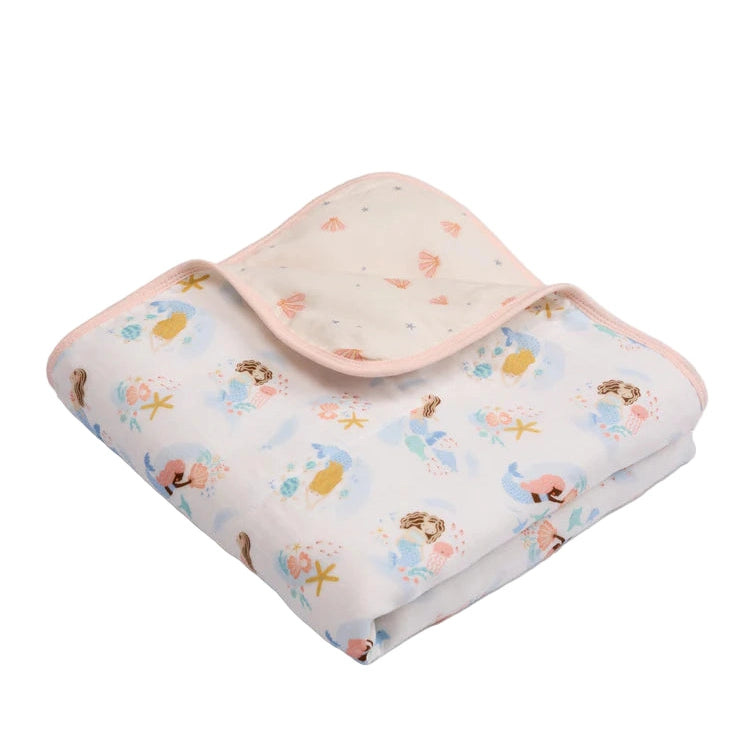 Loulou Lollipop Muslin Quilt Blanket in pale pink seashell and mermaid print, folded to reveal soft muslin layers.