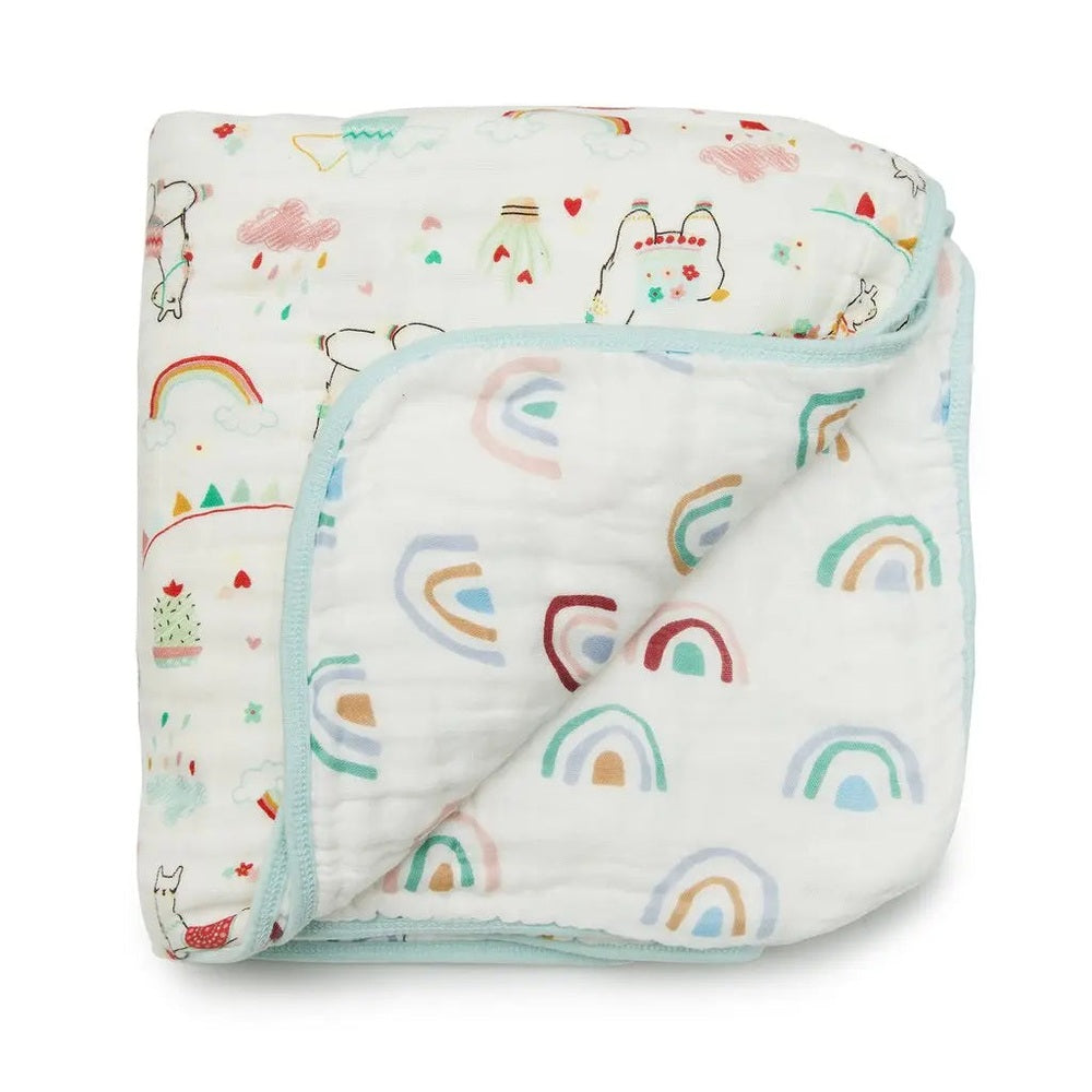 Loulou Lollipop Muslin Quilt Blanket, pastel rainbows with mint trim, folded to reveal soft breathable muslin.