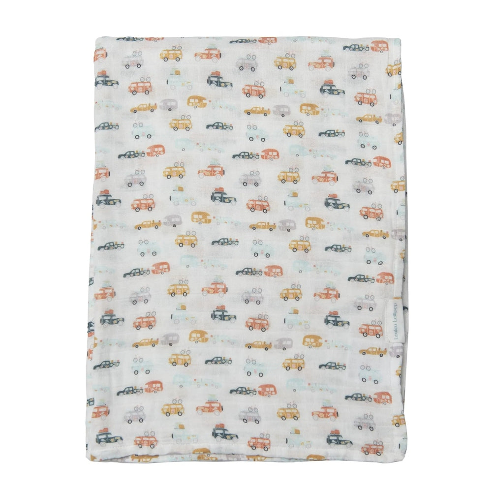 LOULOU LOLLIPOP Muslin Swaddle blanket, pastel car print, folded flat to showcase soft breathable fabric.