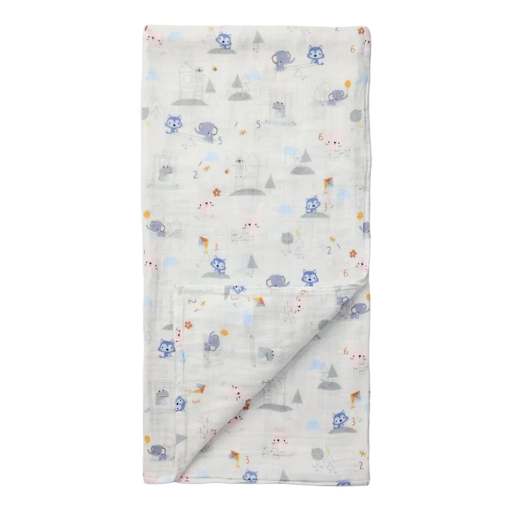 Loulou Lollipop Muslin Swaddle in White with pastel blue animal print, folded corner.