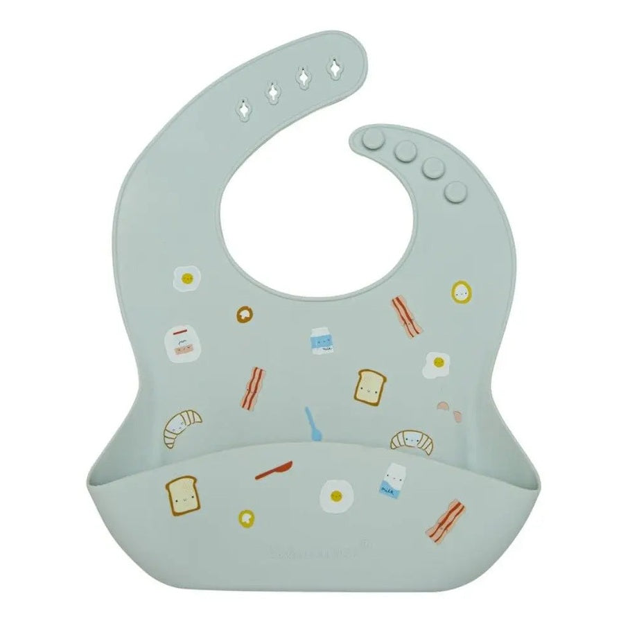 Loulou Lollipop Silicone Bib in pale gray with food illustrations; front pocket catches crumbs as baby eats.