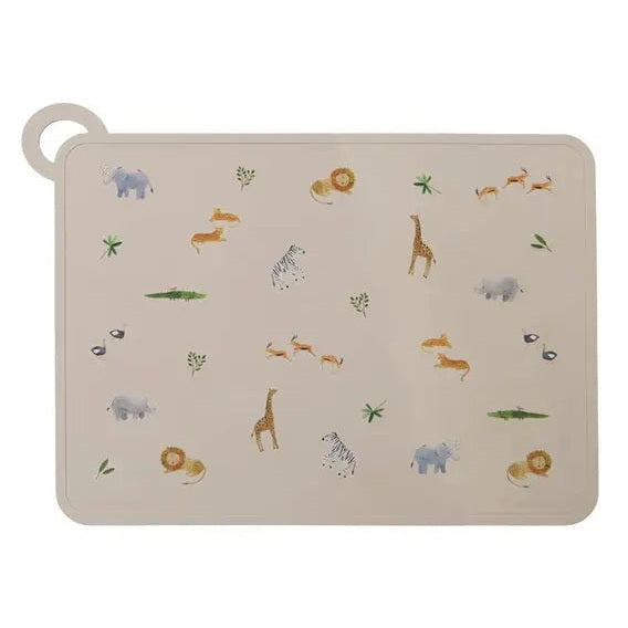 Loulou Lollipop silicone placemat beige with animal print, laid flat on a table to catch spills.
