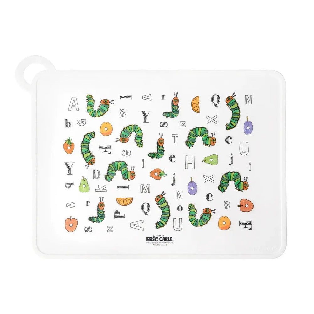 Loulou Lollipop silicone placemat, white with colorful Eric Carle caterpillar alphabet artwork laid flat on a table.