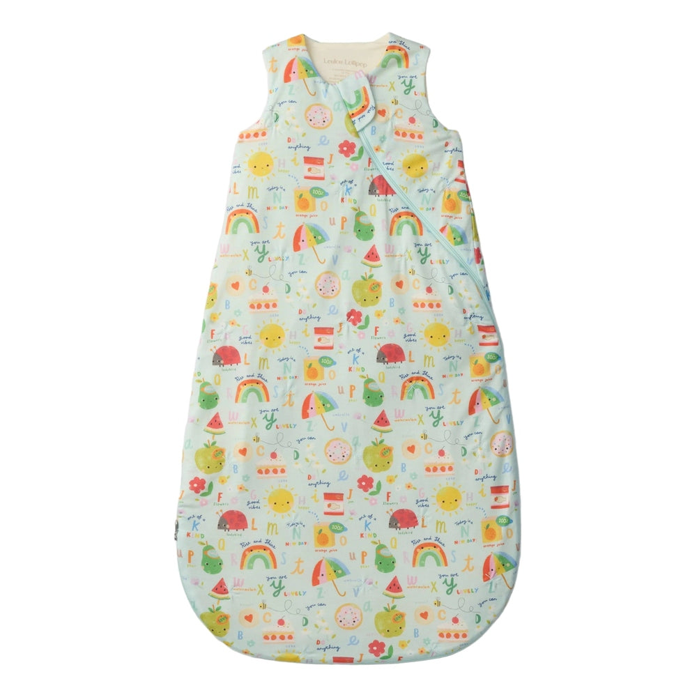 Loulou Lollipop TENCEL™ Sleep Bag 1.0 TOG Alphabet Smiles laid flat in pastel blue to showcase baby sleepwear.