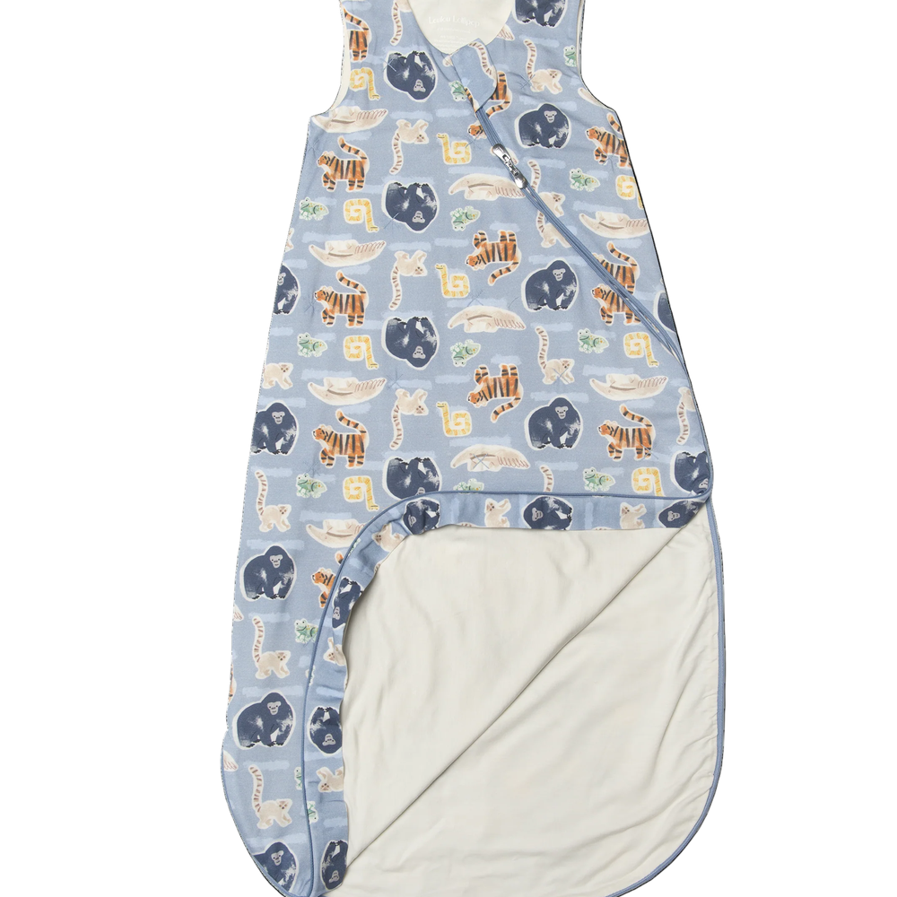 Loulou Lollipop TENCEL Sleep Bag 1.0 TOG Jungle Friends blue with animal print; zipper opening reveals cozy cream lining.