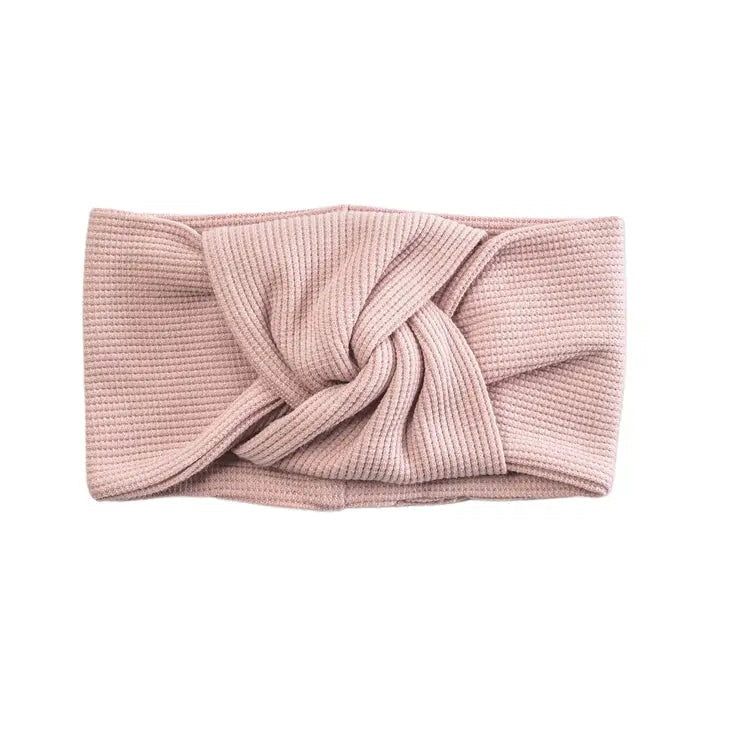 Loulou Lollipop Waffle Knotted Headband Blush Pink laid flat, showing the twisted knot and soft waffle knit.