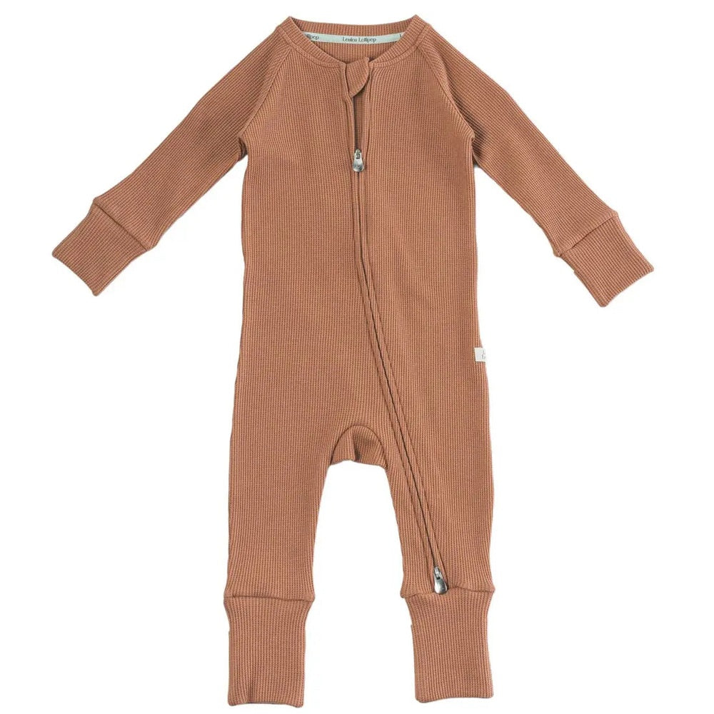 Loulou Lollipop Waffle Sleeper Cinnamon, caramel knit baby romper with zip-front and diagonal zipper and ribbed cuffs.