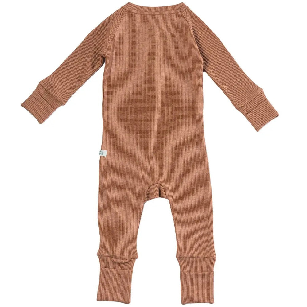 Loulou Lollipop Waffle Sleeper Cinnamon, cinnamon-brown knit footed baby onesie laid flat.