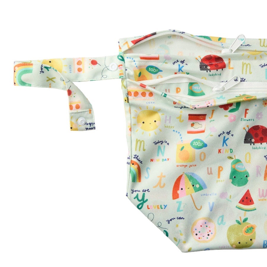 LOULOU LOLLIPOP Wet Dry Bag in pastel fruit print with multiple zip pockets and attached strap.