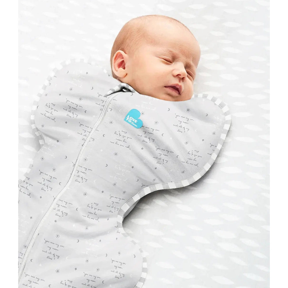 Love To Dream Swaddle Up Cotton 0.2 Tog You Are My Grey; sleeping newborn swaddled in gray with blue logo