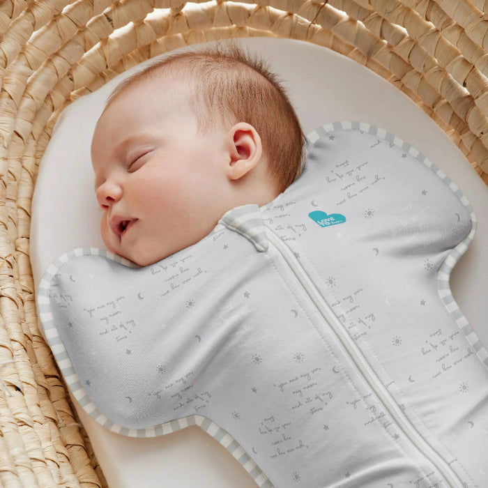 Love To Dream Swaddle Up Cotton 0.2 Tog You Are My Grey baby swaddle; infant asleep, wrapped in grey cotton with striped trim.