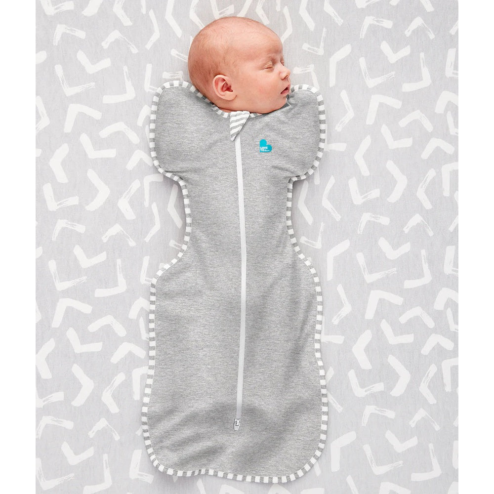 Love To Dream Swaddle Up Original Cotton 1.0 Tog grey infant swaddle; baby sleeping with zipper closed.