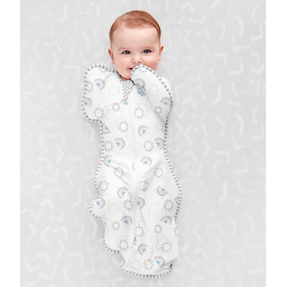 Love To Dream Swaddle Up Original Cotton 1.0 Tog Rainbow White swaddled baby with arms up in cozy breathable cotton.