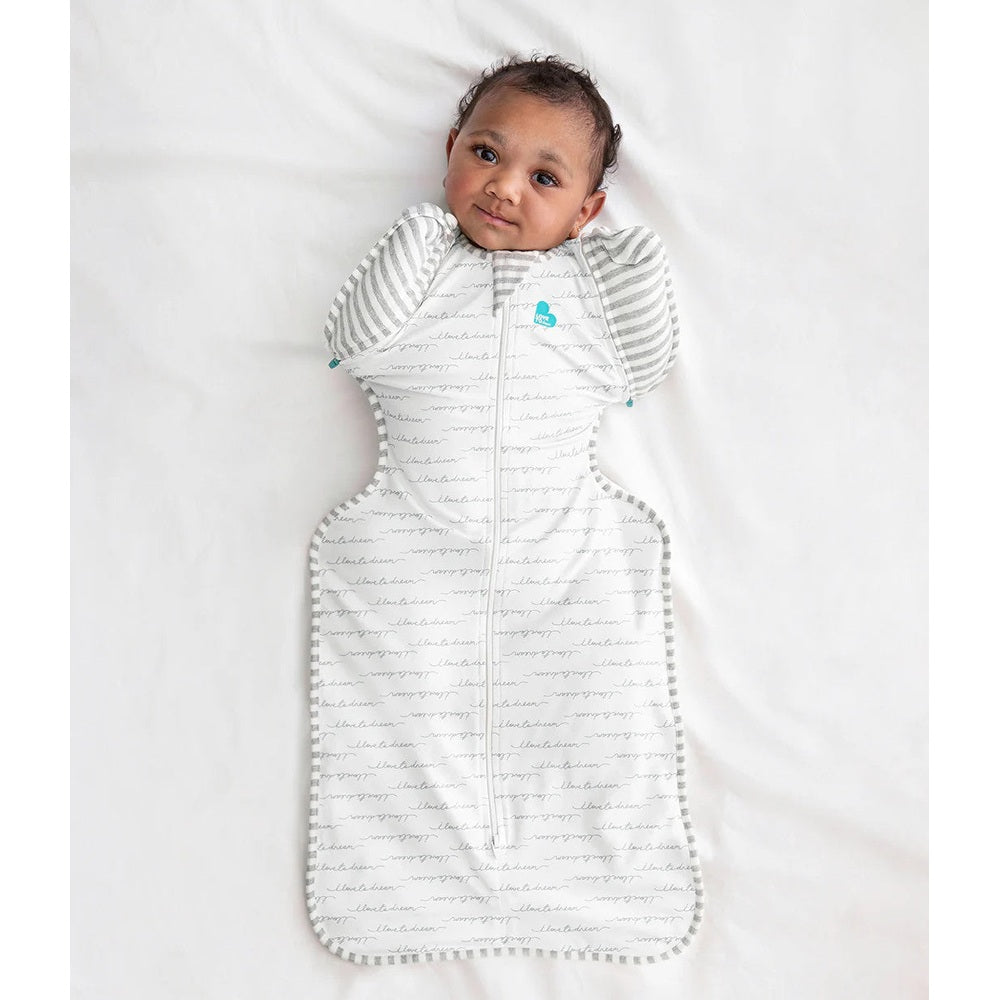 Love To Dream Swaddle Up Transition Bag Original Cotton 1.0 Tog in white with gray striped sleeves, baby shows arms-up transition.