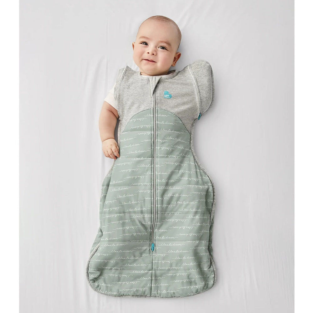 Love To Dream Transition Bag Quilted Cotton Olive Dreamer 2.5 Tog: baby lying on back in a zipped front sleep sack.