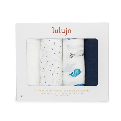 Lulujo baby bamboo muslin swaddle blankets 4-pack with whales and stars in white and blue.