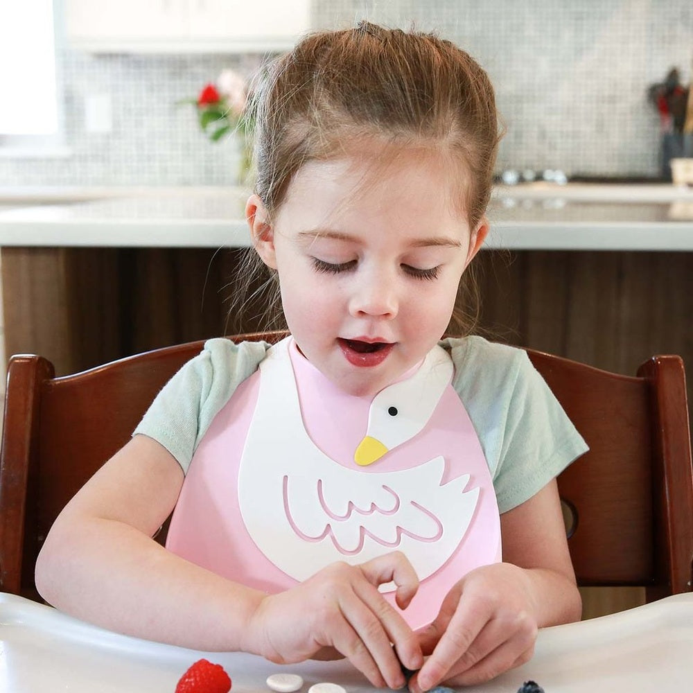 Make My Day Swan Dive bib pink with white swan graphic for mealtime
