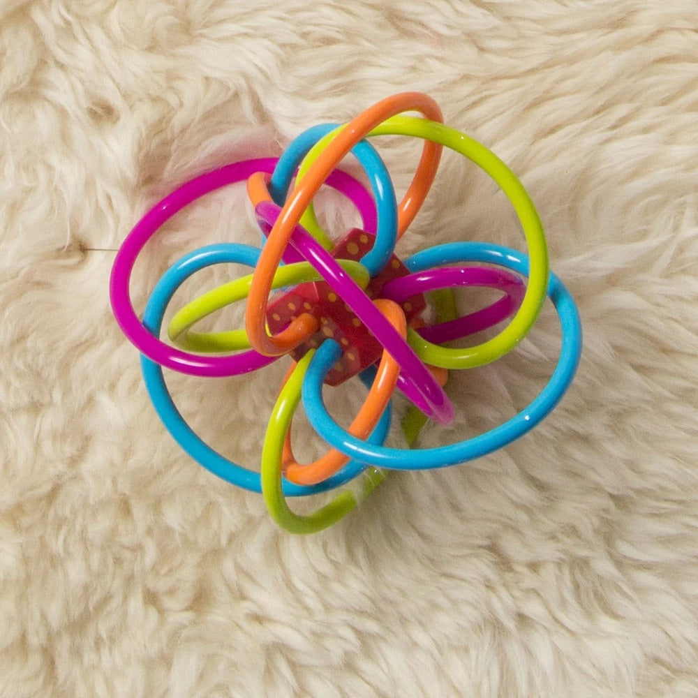 Manhattan Toy Winkel Rattle Sensory Teether Toy featuring bright interlocking rings for teething and grasping.