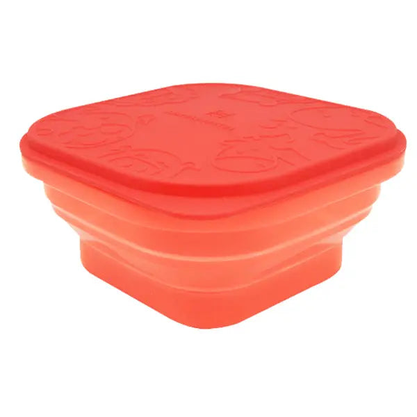 Marcus & Marcus Collapsible Snack Container in red silicone, shown collapsed into a compact stack with lid.