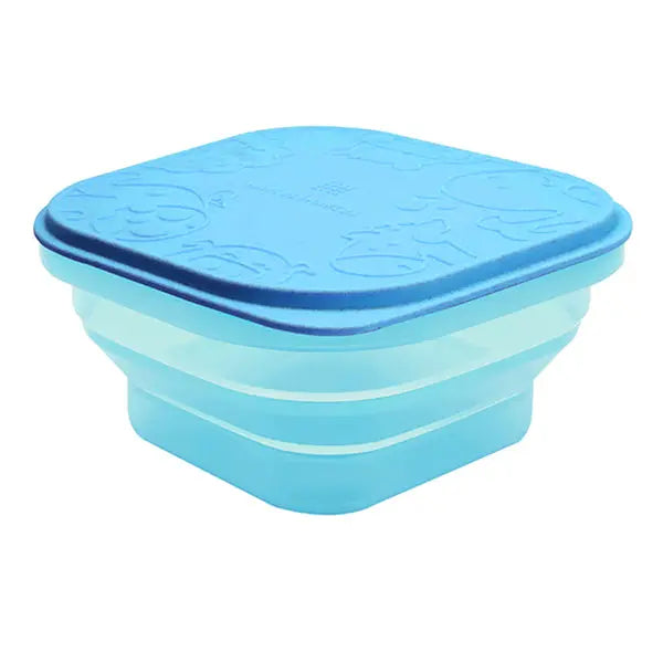 Marcus & Marcus Collapsible Snack Container in blue silicone with lid, shown collapsed into a compact stack.
