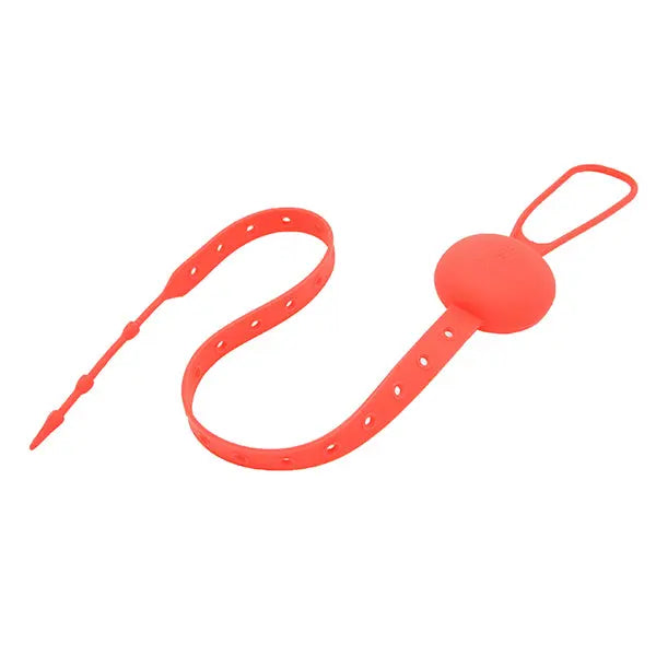Marcus & Marcus Flip N' Strap silicone baby feeding strap in red, adjustable strap fastened around a silicone ball.