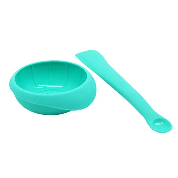 Marcus & Marcus Masher Spoon and Bowl Set in teal silicone, two-piece baby feeding set shown ready for use.