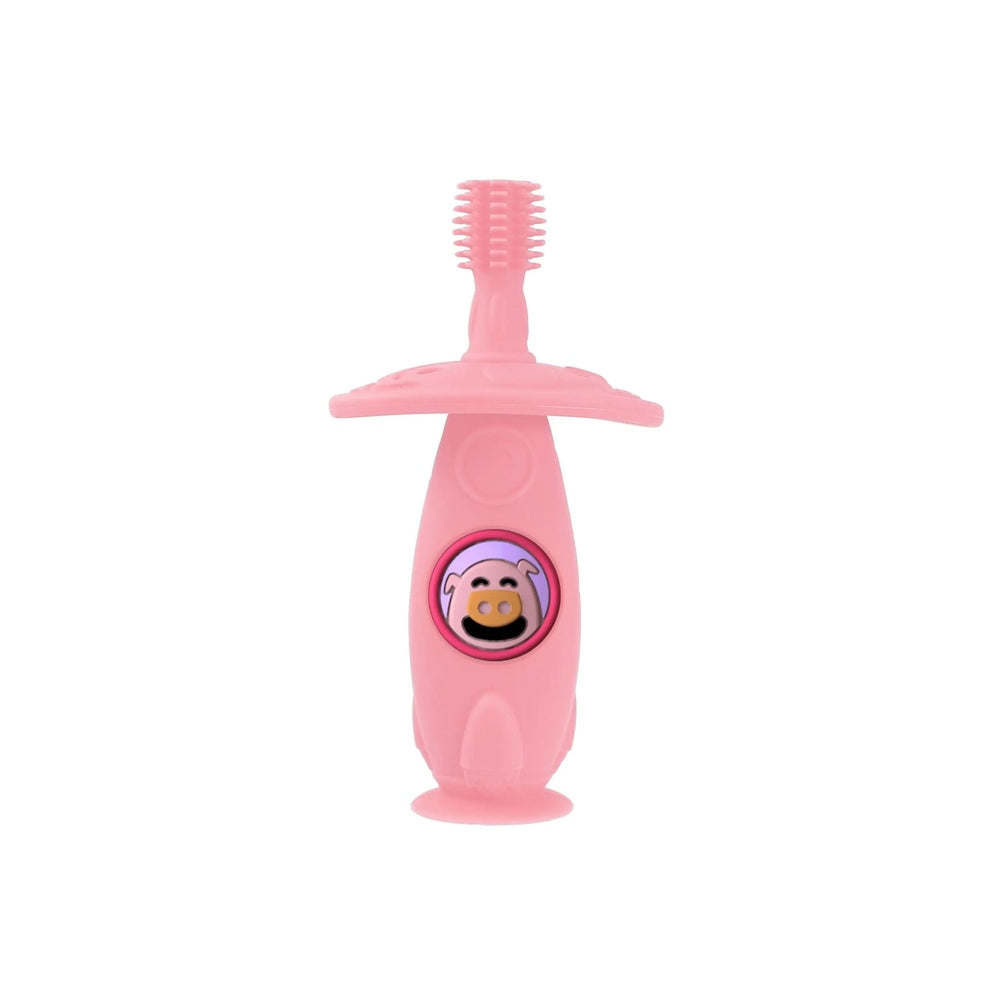 Marcus & Marcus Self Training 360 Toothbrush in pink with suction base, pig logo, standing upright.
