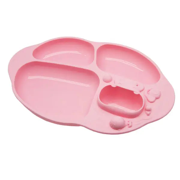 Marcus & Marcus Yummy Dips suction divided plate in pink silicone with three compartments held to the table by suction.