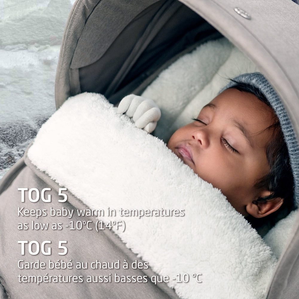 MAXI COSI 2 In 1 Footmuff Twillic Truffle; plush white fleece cocooning sleeping baby in stroller