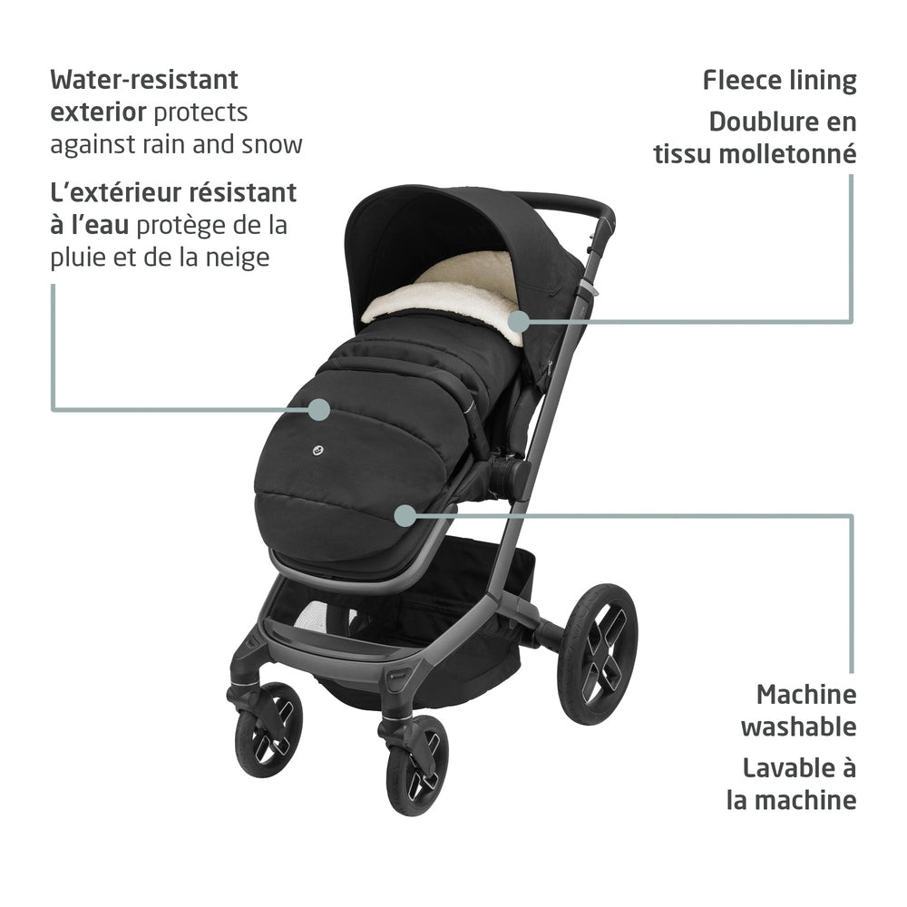 MAXI COSI 2 In 1 Footmuff Twillic Black on a stroller, showing a water-resistant exterior, fleece lining, and machine-washable fabric.