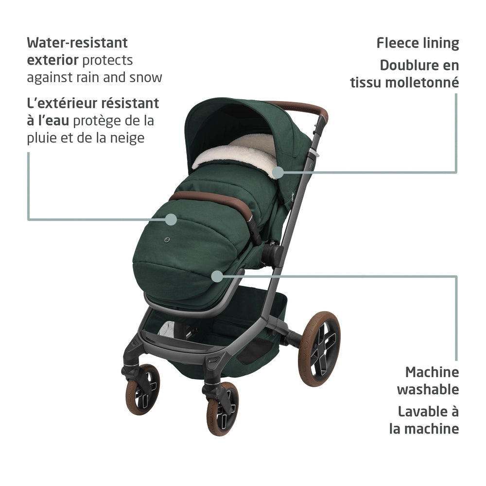 MAXI COSI 2 In 1 Footmuff Twillic Green on a green stroller, showing water-resistant exterior, fleece lining, machine-washable fabric.