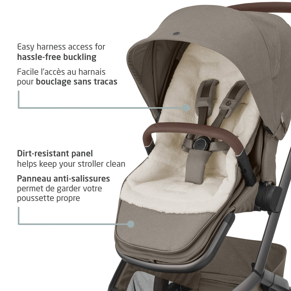 MAXI COSI 2 In 1 Footmuff Twillic Truffle on a stroller, fleece lining and easy-harness access for buckling.